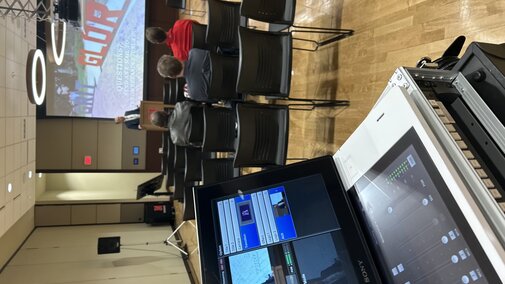 view of live-streamed candidate seminar from behind the video switcher