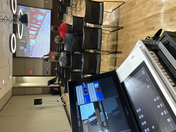 view of live-streamed candidate seminar from behind the video switcher